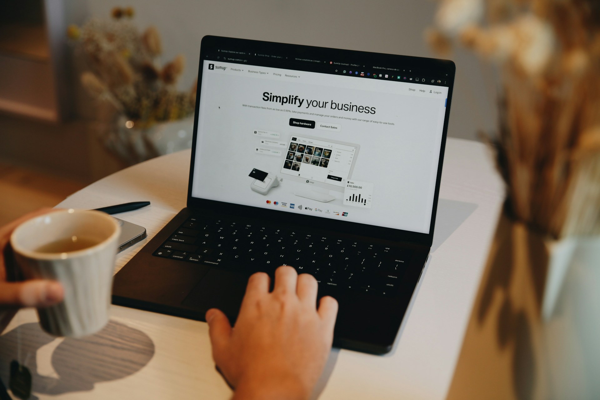 Person reviewing a small-business website on a laptop.